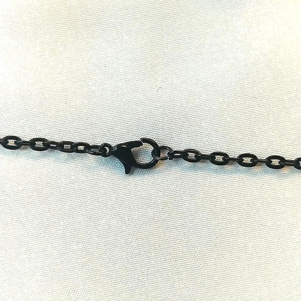 Vintage magnetic charm necklace. 26 inch. Comes with 4 charms.